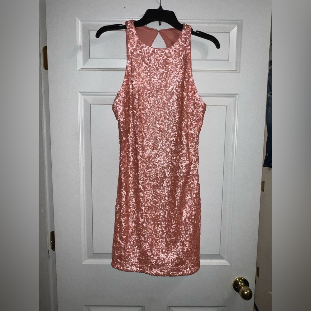 Pink sequin open back dress.